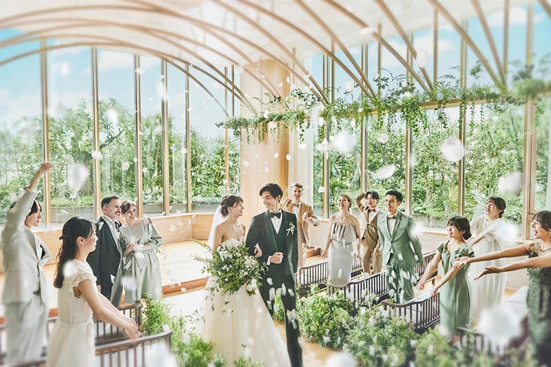 A confetti shower for the couple in the glasshouse chapel at ampersand By LAGUNAVEIL ATELIER