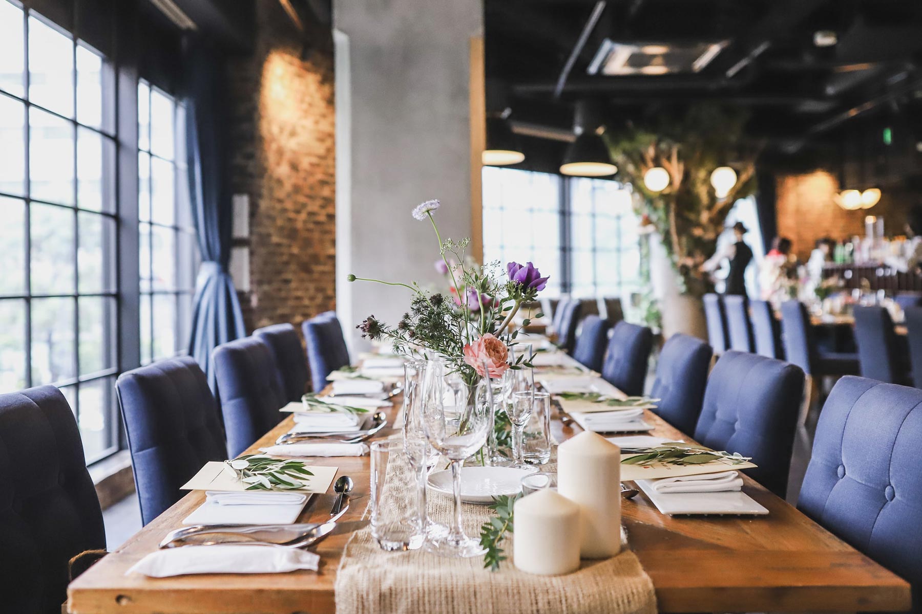 A long wedding table prepared inside JAM ORCHESTRA