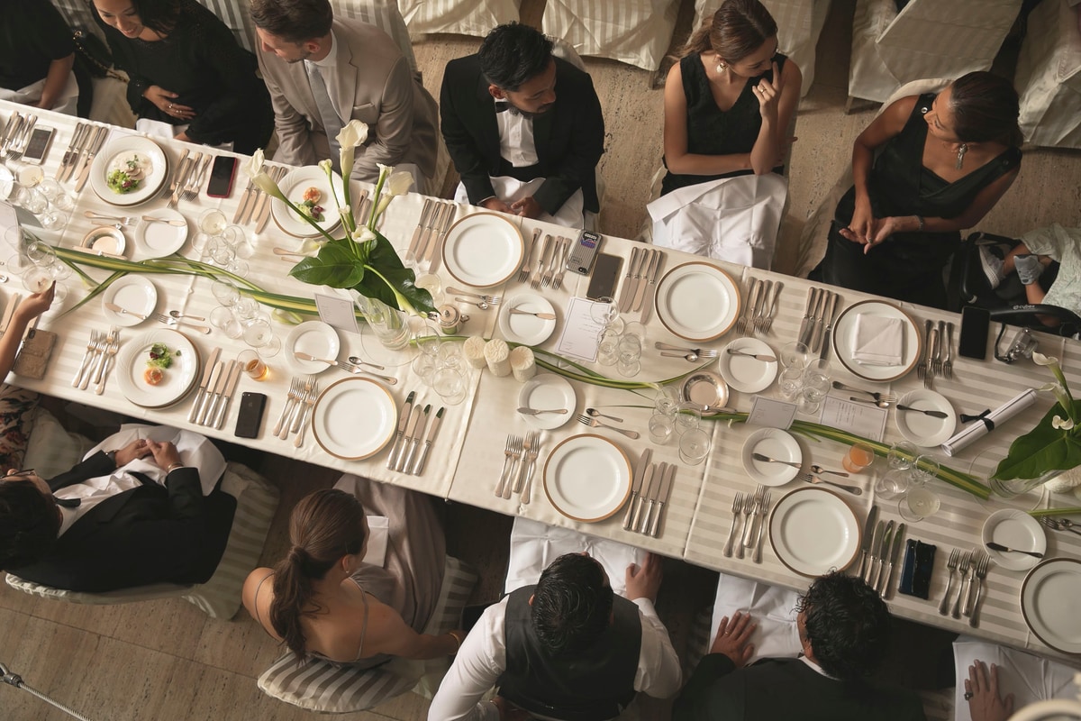 Guests seated around a long reception table viewed from above