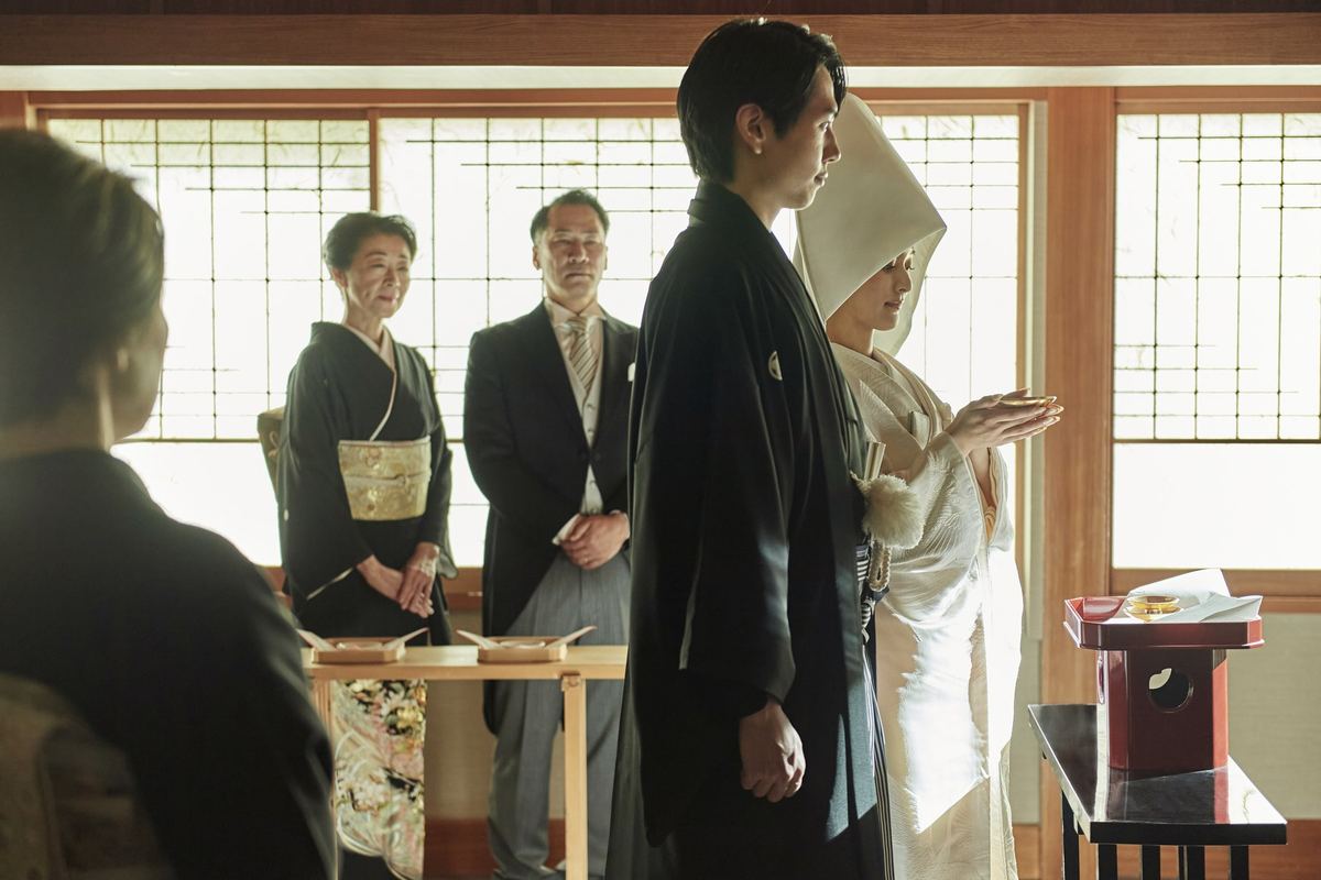 A couple taking part in a traditional Shinto ceremony
