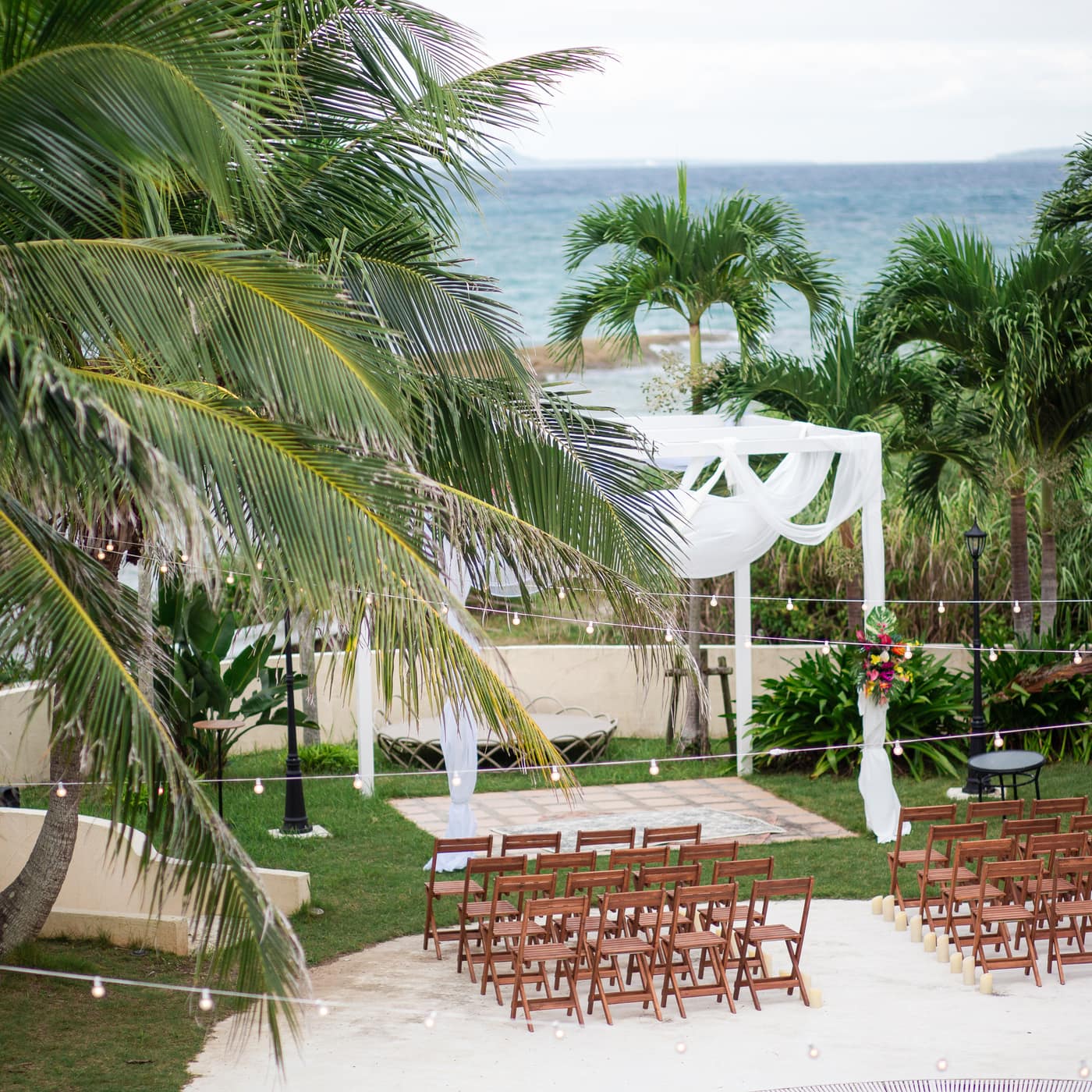 The ocean-view garden prepared for an outdoor wedding ceremony