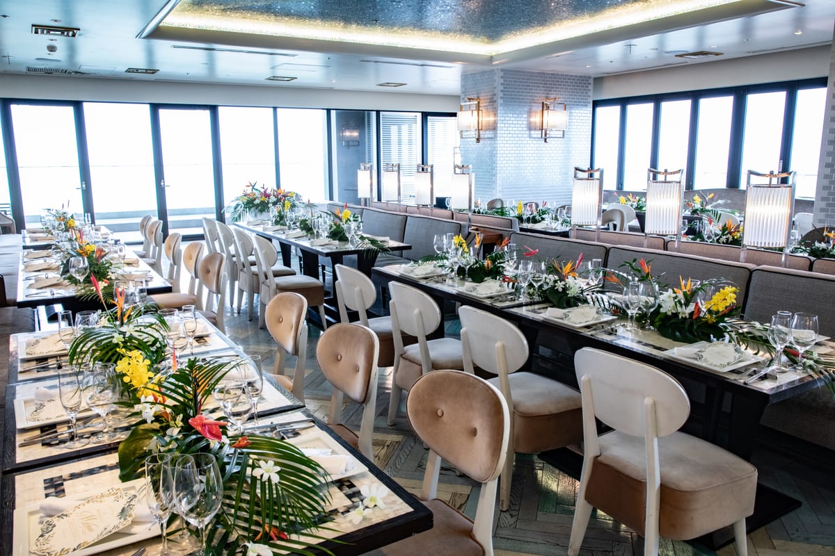 The reception room set with tropical flower arrangements