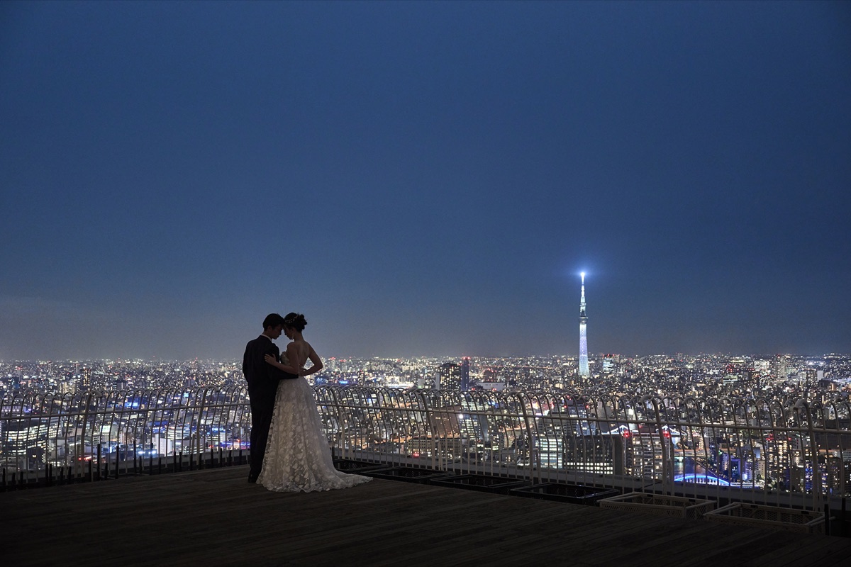 Tokyo Skytree glowing beyond the venue at night