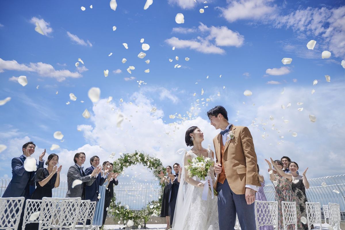 Guests showering the couple with petals on the terrace